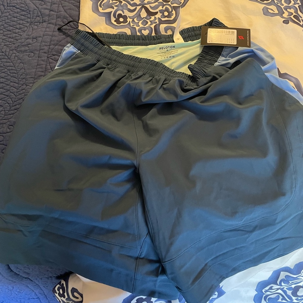Peloton Dolphin Hem Short. M. NWT.